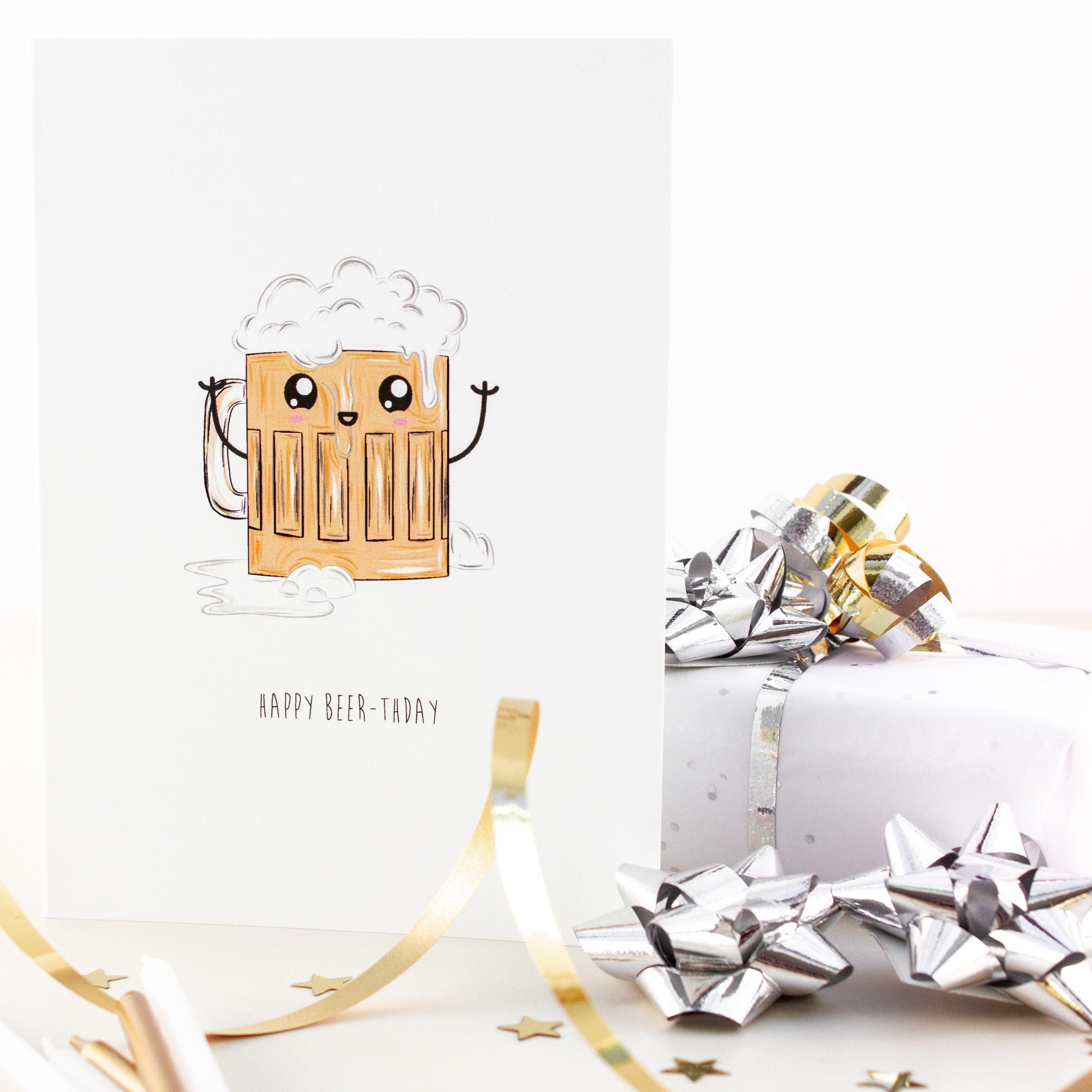 Quirky greeting card with an illustration of a beer mug filled to the top with beer and froth on top. The mug has a cartoon style face.